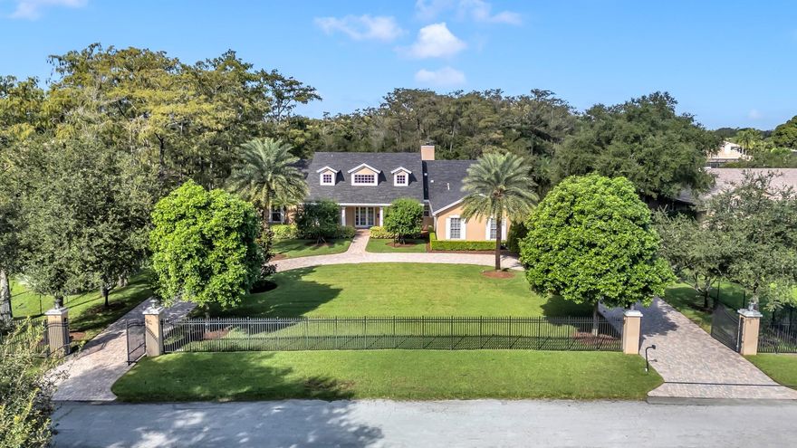 Experience timeless elegance & modern Florida living in this stunning 5-bedroom, 3.5-bath estate home in the sought after community of Pine Tree Estates, Parkland, FL — with NO HOA! Nestled on a private 1.09-acre wooded lot, this residence blends Northern charm with the airy feel of South Florida luxury. A stately gated circular driveway, manicured lawn, & grand entryway set the tone. Enjoy an open kitchen and family room with rich wood cabinetry, top-tier appliances, a large island, and generous space for entertaining. Each of the five bedrooms are filled with natural light, featuring custom closets, peaceful pool or garden views, and a warm ambiance. The private backyard is a tropical retreat with a sparkling pool, outdoor summer kitchen, two gated animal runs & lush mature landscaping.
