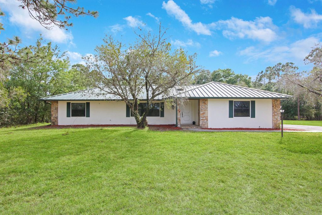 Photo of 7835 Saddlebrook Drive, Port Saint Lucie, FL 34986 (MLS # R10784340)