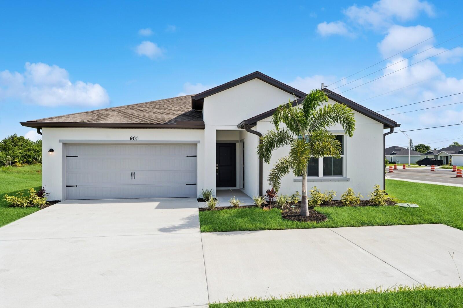 The Passionflower II is a single-family home plan in Port St. Lucie, offering the added benefit of no HOA fees. The home features a covered porch that leads into a bright foyer, setting the tone for the rest of the space. The kitchen is enhanced by Sinclair Sarsaparilla cabinetry, which provides a rich contrast and elevates the overall aesthetic. The vaulted ceiling in the great room and dining area creates a sense of openness and airiness, while sliding doors open from the great room to the covered patio, perfect for outdoor living. The primary suite offers a spacious walk-in closet, and the chrome fixtures in the primary bath add a sleek, modern touch. Additionally, the Extra Suite Plus provides a private living space and bath, ideal for added privacy and multi-generational living. This