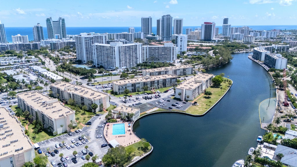 Photo of 801 THREE ISLANDS Boulevard #303, Hallandale Beach, FL 33009 (MLS # B26080149)