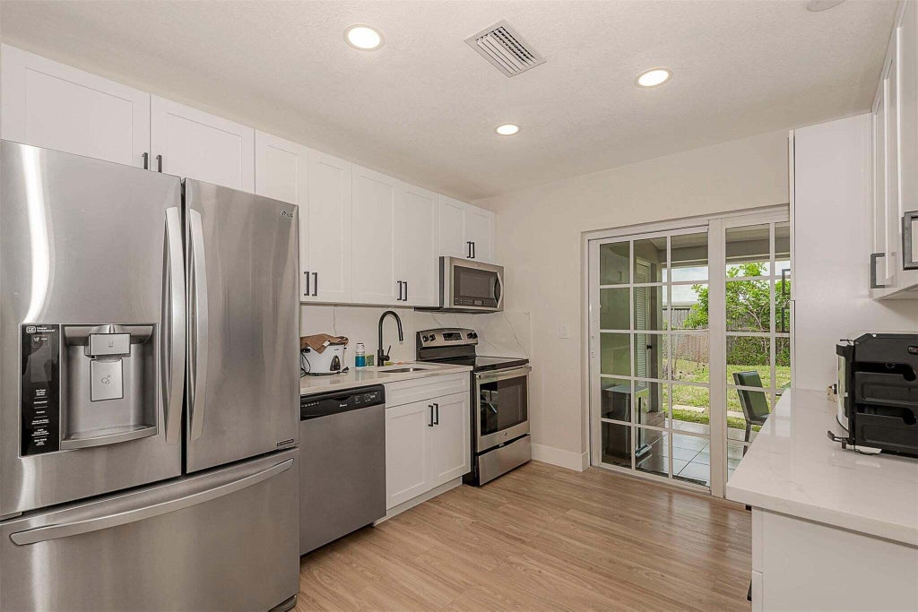 Photo of 1449 SE 4TH Avenue #1449, Deerfield Beach, FL 33441 (MLS # B26059821)