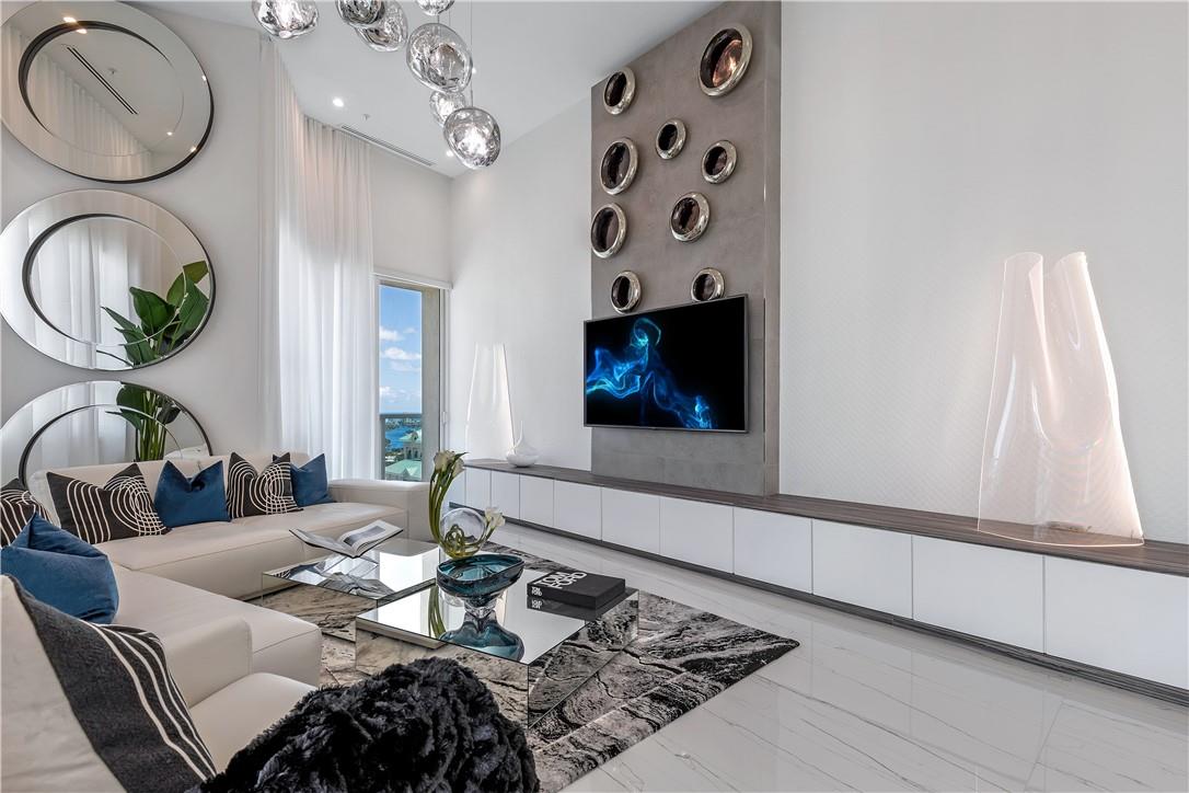 Welcome to the Grand Penthouse, one of only 3 penthouses and the largest unit in 350 Las Olas Place. Brand new complete gut renovation with no expense spared by world renowned design team Magni A Design. The Grand Penthouse is a modern work of art and an absolute showstopper with 15 foot ceilings and forever views on 3 sides, of downtown, west to the everglades, and east to the ocean. Full amenity luxury building in the heart of downtown, with valet, secure garage, and full time security and management. On the roof: large pool, jacuzzi, huge glass-walled fitness center, theater, and Club Room. Brand new, not lived in since 2022 renovations. For the rarefied few, this magnificent one of a kind home in the sky is waiting!
