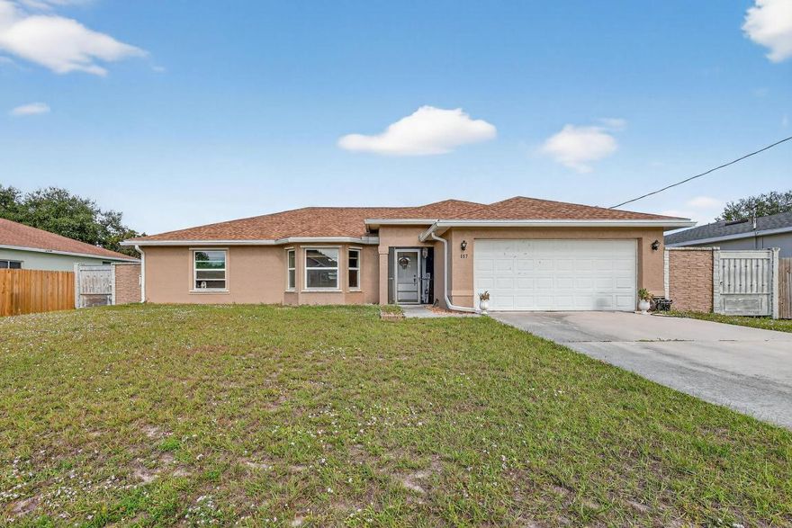 Welcome to this beautifully maintained 2,000+ sq ft Port St. Lucie home, offering a spacious fenced yard with a solid concrete privacy wall. Inside, enjoy tile flooring throughout, upgraded bathrooms with tiled showers, and a versatile additional room perfect as a 4th bedroom, den, or office. The kitchen features upgraded cabinets and granite counters, and the owner is including all appliances. Home offers peace of mind with a 2022 roof and impact windows. Outside you'll find an additional storage shed and a quiet neighborhood close to schools, shopping, and main roads. Move-in ready and a must-see!