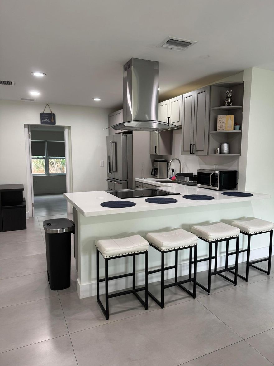beautifully remodeled, this home offers comfort and style from the moment you arrive. It features 3 spacious bedrooms and 2 full bathrooms, perfectly set up for an easy, move-in-ready stay. Private laundry with fenced in yard & patio. NO HOA! A must see

Enjoy your own private home cinema, ideal for relaxing movie nights. Step outside to a peaceful backyard oasis with a mature tree and a cozy outdoor lounge area.

Located in West Palm Beach, this home is a perfect rental opportunity, combining a great location with quality living and convenience.