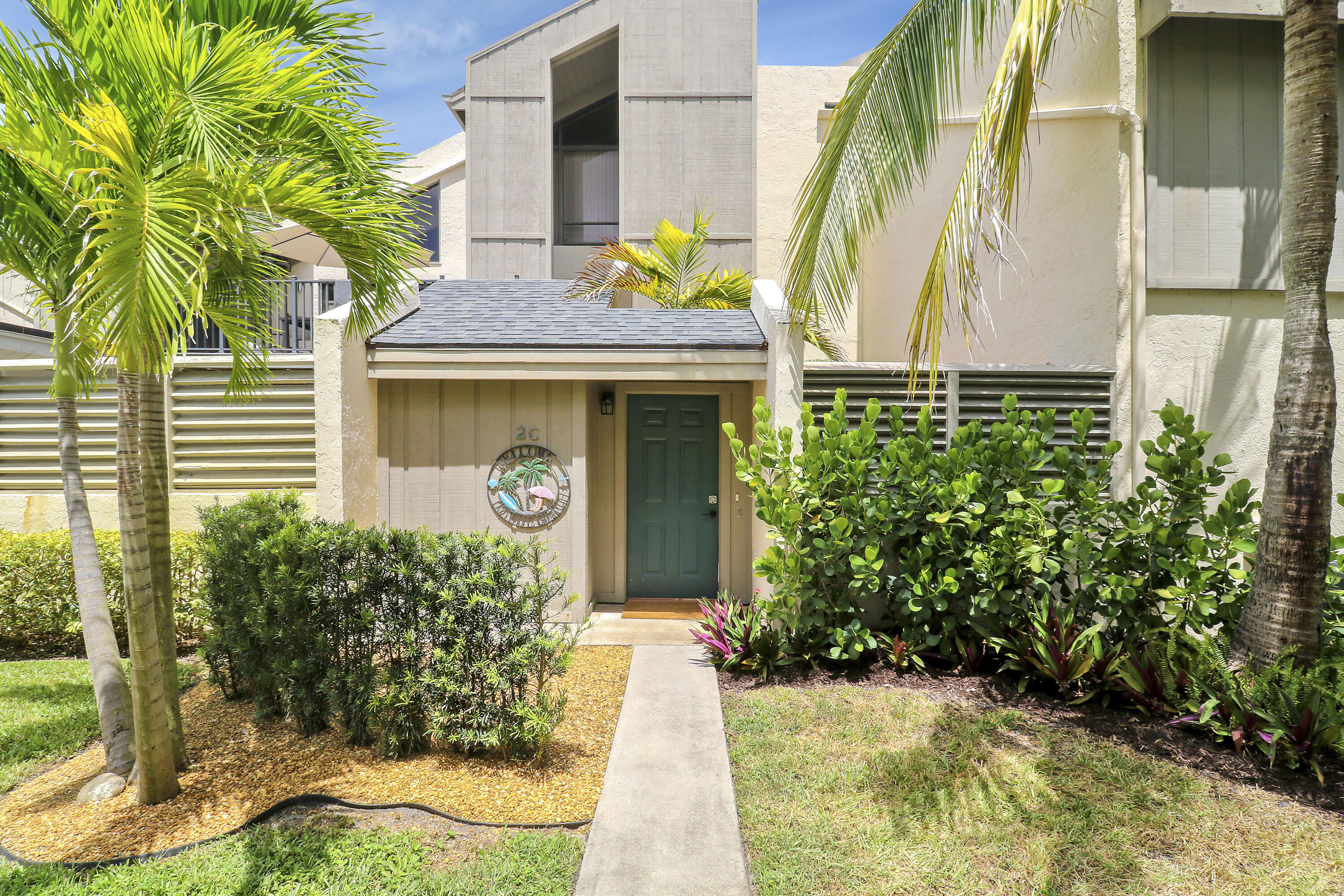Perfect Beach Getaway in Charming Jupiter! Just a short stroll down the sidewalk to the beach, this beautifully remodeled 1-bedroom, 1-bathroom unit is the ideal coastal retreat or investment opportunity. The open floor plan has been thoughtfully reconfigured to create a more spacious living area and a separate entrance to the bathroom for added privacy.The kitchen shines with brand-new cabinets, expanded storage, sleek quartz countertops, and all-new stainless steel appliances (2024). The bathroom has been tastefully updated with a modern shower, new vanity, and added storage, plus a convenient stackable washer and dryer. In the bedroom, you'll find a custom modern closet and built-in desk--perfect for maximizing space and functionality. Step outside to a private courtyard featuring