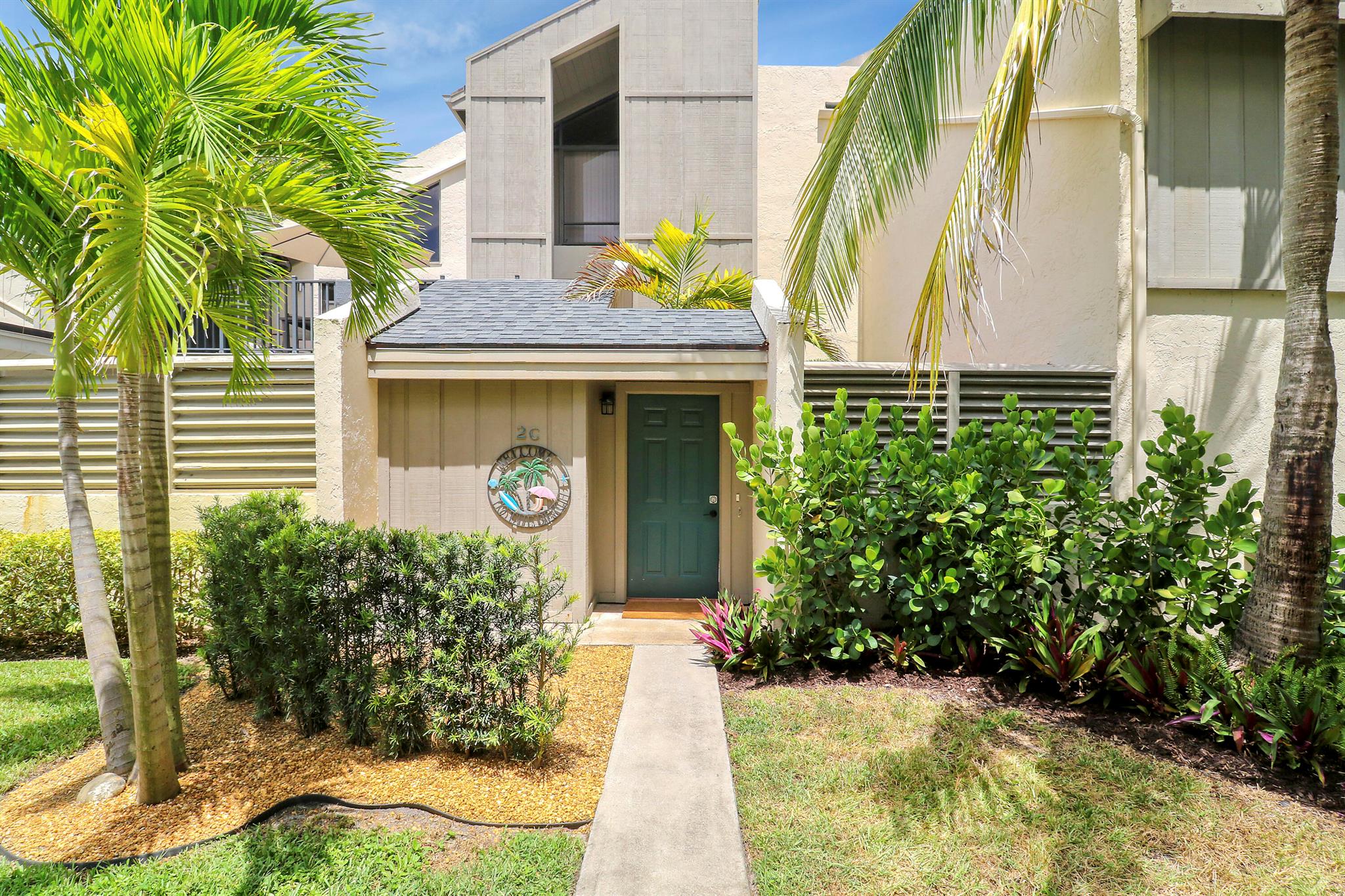 Perfect Beach Getaway in Charming Jupiter! Just a short stroll down the sidewalk to the beach, this beautifully remodeled 1-bedroom, 1-bathroom unit is the ideal coastal retreat or investment opportunity. The open floor plan has been thoughtfully reconfigured to create a more spacious living area and a separate entrance to the bathroom for added privacy.The kitchen shines with brand-new cabinets, expanded storage, sleek quartz countertops, and all-new stainless steel appliances (2024). The bathroom has been tastefully updated with a modern shower, new vanity, and added storage, plus a convenient stackable washer and dryer. In the bedroom, you'll find a custom modern closet and built-in desk--perfect for maximizing space and functionality. Step outside to a private courtyard featuring