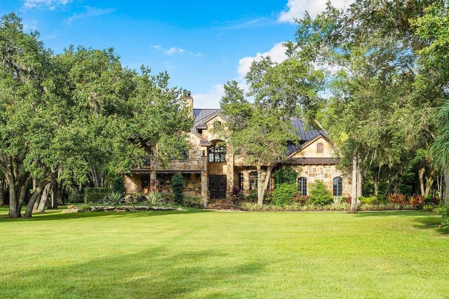 Welcome home to your pristine country estate in St Lucie County with 5 bedrooms, 3.5 bathrooms, 4 car garage and 20 acres of privacy to disconnect, entertain family and friends, or enjoy some of natural Florida. Incredible attention to detail on this custom built estate. Property is sold furnished. Impact windows throughout, gas powered appliances including stove, dryers, pool heater, bbq grill, and both fireplaces. Property has four horse stall, irrigation pond, koi pond, partial electric perimeter fence, security camera system, extensive landscape lighting, secure gate with call box, dozens of native Florida trees, and so much more.