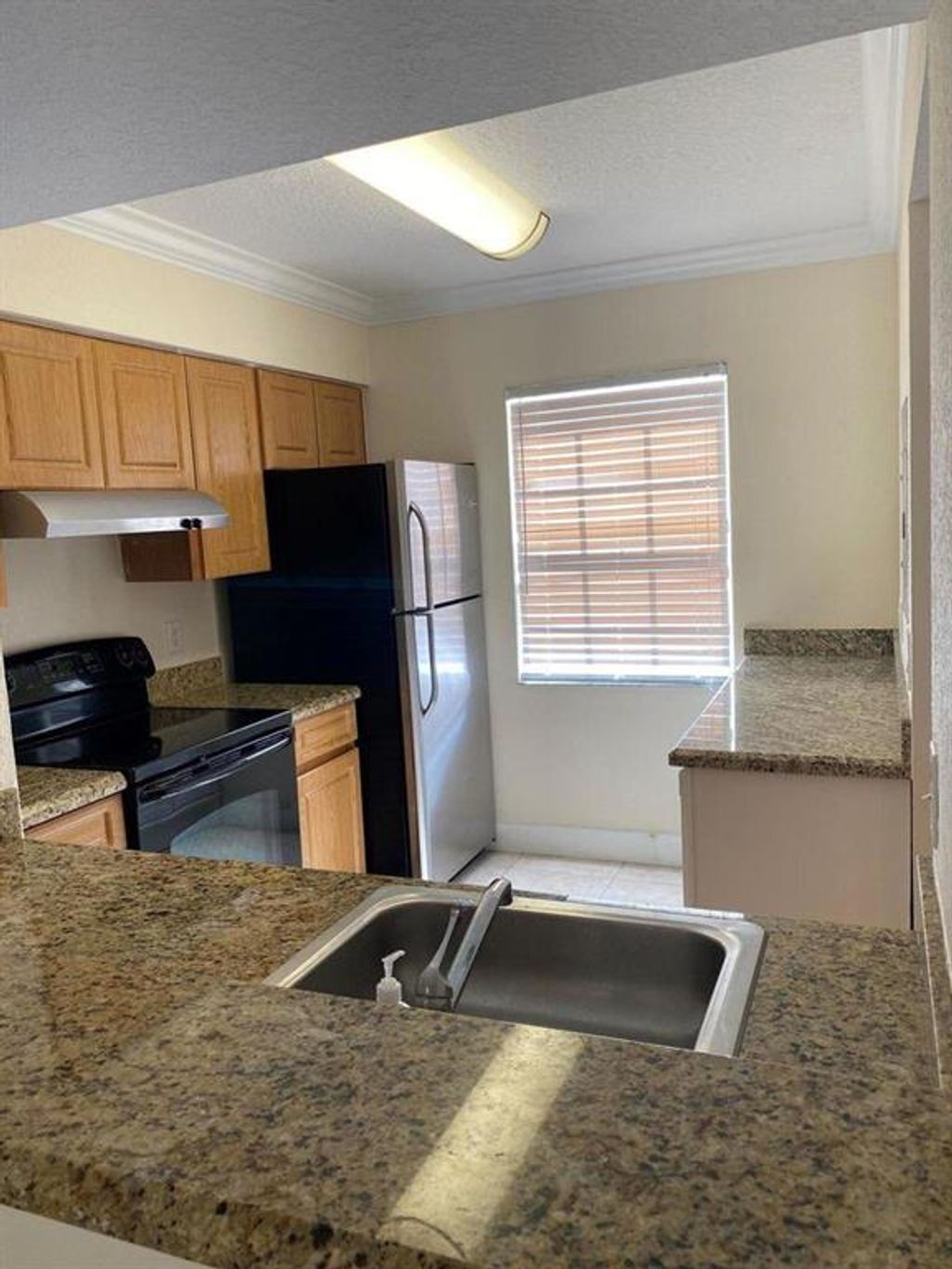 Photo of 1105 Lake Shore Drive #203, Lake Park, FL 33403 (MLS # R10797910)