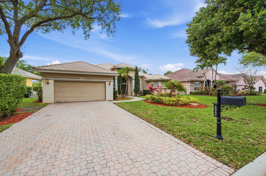 Photo of 5040 NW 57th Terrace, Coral Springs, FL 33067 (MLS # B26005574)