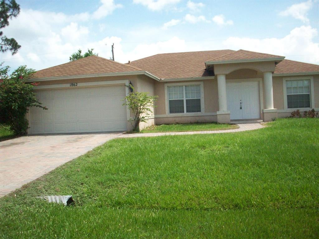 Photo of 1862 SW Grant Avenue, Port Saint Lucie, FL 34953 (MLS # R10707182)