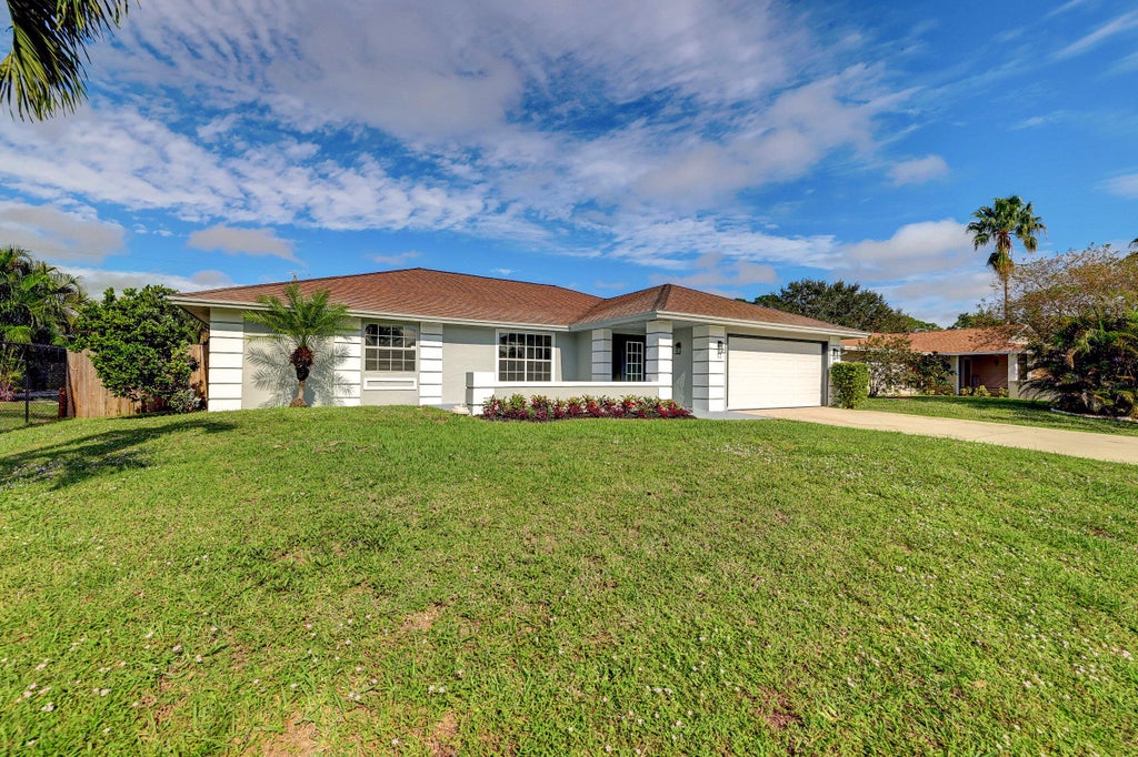Photo of 325 SE Wallace Terrace, Port Saint Lucie, FL 34983 (MLS # B26083107)