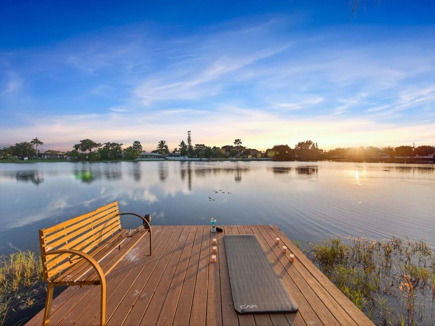 Discover a truly unique lakefront lifestyle at this 3-bedroom, 3-bath residence where every space is designed for relaxation, entertainment, and waterfront enjoyment. A peaceful Cul-de-sac, this home sits on a pie-shaped lot offering panoramic views. Step outside and experience one of the most impressive backyards in the area. Features a resort-style backyard with a pool, tiki hut, dock, covered grilling station, outdoor bar, deck, and access to kayaking on the lake. Bright open-concept kitchen/living area with granite counters, wood cabinets, large walk-in pantry, a dedicated coffee bar area adds a charming, functional touch for daily comfort and spacious primary suite and split floor plan. GYM Room + shed provides excellent storage. Metal roof 2021, HVAC 2019, tankless water heater 2020.