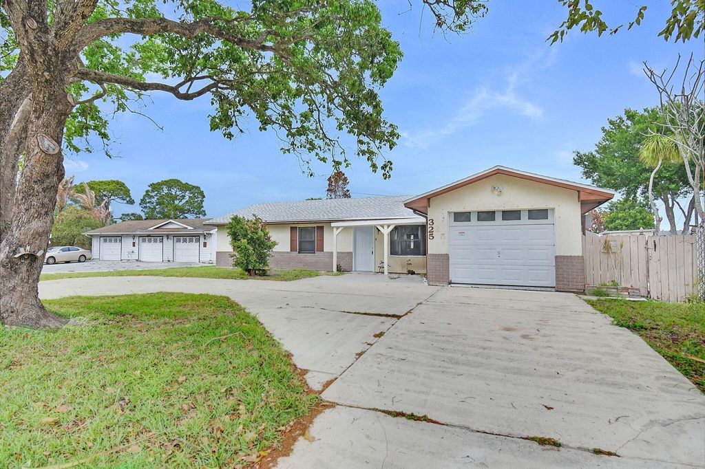 Photo of 325 NW Rebecca Avenue, Port Saint Lucie, FL 34983 (MLS # B26014074)