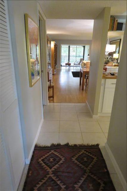 Great Location and Condominium. Close to shopping, restaurants, I-95 and the Turnpike. Meticulously maintained home in gated Banyan Springs. The lania is impact glass enclosed with a view of the lake. Beautifully updated tile and wood flooring throughout and Plantation Shutters. Tennis players this is a fantastic place to learn and play tennis! There are teams to join and a tennis pro on site. The amenity package also include pools, hot tubs, poolside cafe, grill & picnic area. Updated fitness room with a personal trainer, hair & nail salon, as well as a beautifully maintained clubhouse. Greatest Social Club in the area! Monthly live entertainment, numerous clubs, card rooms, billiards room, art club & even an art room, shuffleboard, bike, walk or jog on private sidewalks and more.