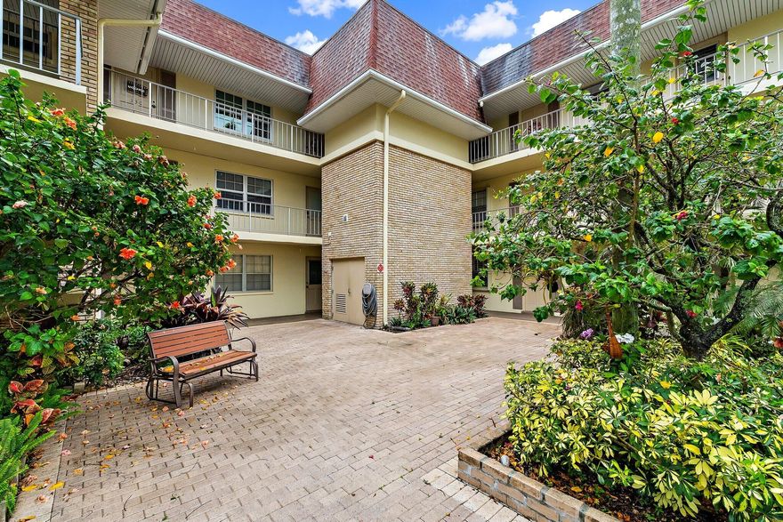 Lowest price renovated 1st floor condo with enclosed patio and a dedicated covered parking space available in Tamberlane.  Owner is motivated to sell and has paid the COA special assessment in full.  Renovated interior is immaculate & ready for your arrival and personal touches!  Spacious split floor plan offers ceramic tile flooring in the living areas, laminate wood flooring in the bedrooms, crown moldings, ceiling fans & plantation shutters. Updated kitchen is open to the living room and has updated appliances & cabinetry.  Large open living & dining area with access to the enclosed patio. Master suite offers a renovated en-suite full bathroom and a walk-in closet. Guest suite is located on the opposite side of the home, has ample closet space, and an en-suite full bathroom. C Condo is located steps away from community laundry room. Exterior features accordion hurricane protection, covered entry, a reserved covered parking space, exterior storage room, a building elevator, is steps to the laundry facilities, and is a short walk to the clubhouse, pool, and barbeque/picnic areas.