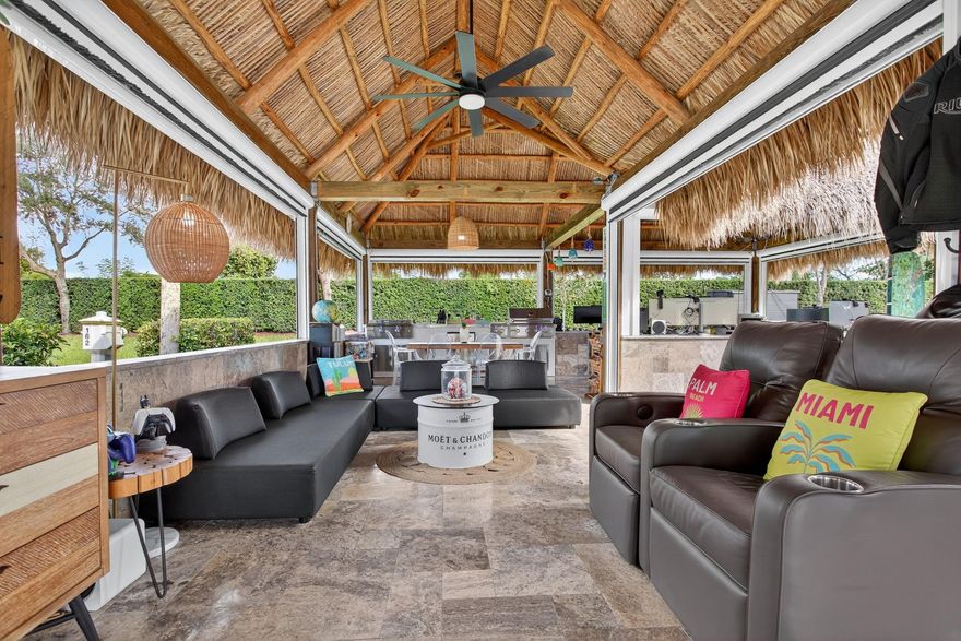 Claim your slice of paradise. Bring your CLASS A motorcoach to AZTEC RV RESORT and settle into the lifestyle you deserve—complete with your own private tiki, perfect for entertaining or unwinding in tropical style. Prime location near beaches, Fort Lauderdale Airport, dining & entertainment. Property features a 4,229 SF lot located in a loop with no rear neighbors, Large L-shaped tiki 30 x 40 with concrete walls and travertine flooring, an outdoor kitchen (Paradise Grill) with cooktop, BBQ, and burner, marble countertop with office/bar section, hurricane-rated screens and shutters, mosquito control system (Swat system), travertine edging around the lot. Newly built in 2023 with permits. Onsite, you will find a state-of-the-art fitness center and a packed calendar of seasonal activities.