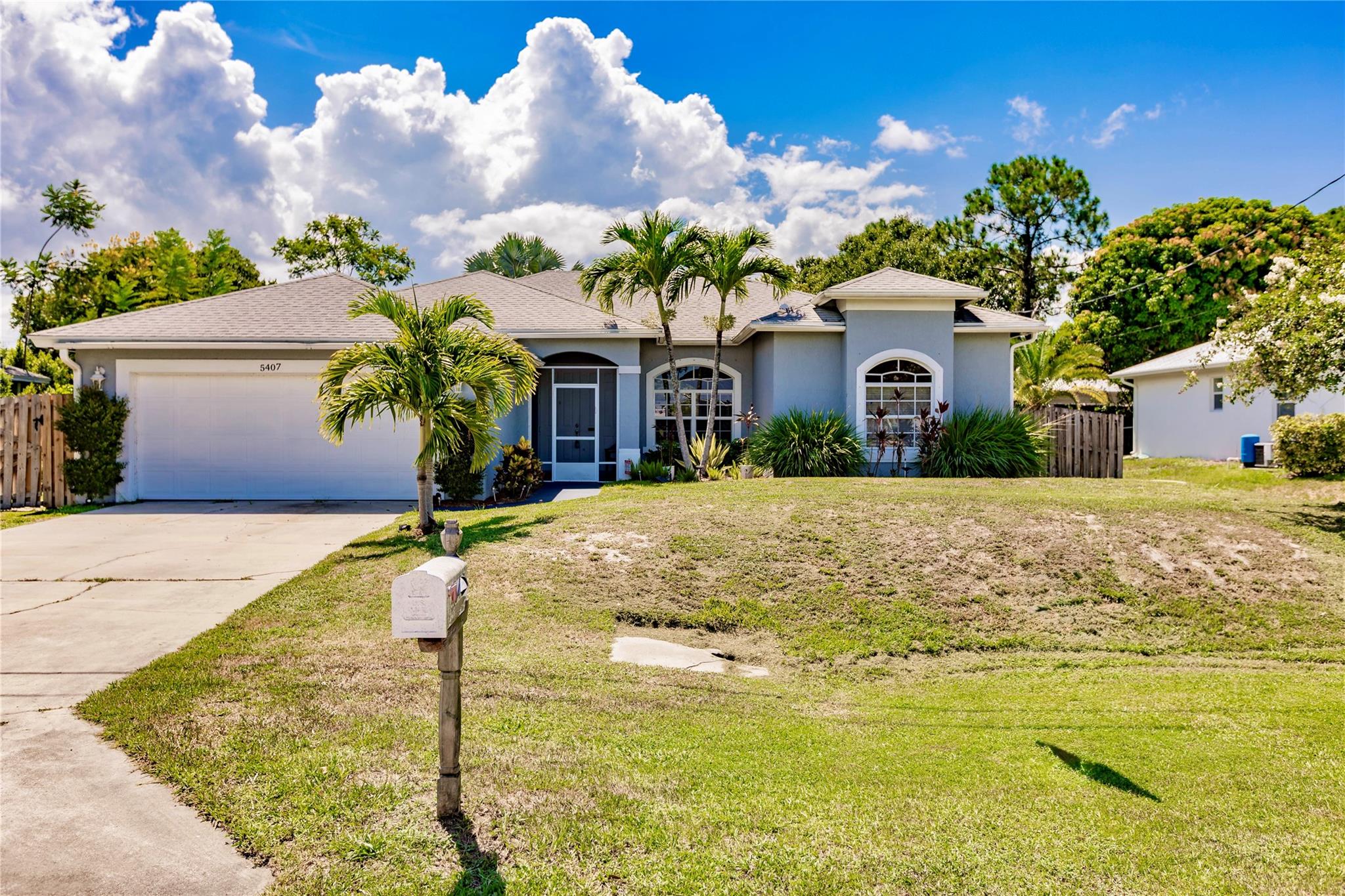 Welcome to this inviting 3-bedroom, 2-bath home in the desirable Indian River Estates neighborhood of Fort
Pierce. Featuring a functional split-bedroom floor plan, this home offers comfort and convenience for everyday
living. The primary suite boasts elegant tray ceilings and a private bath, providing a relaxing retreat. Tile flooring
flows through the main living areas, while the bedrooms offer cozy carpeting. The eat-in kitchen and separate
dining area make mealtime a breeze. Enjoy the enclosed screened porch, perfect for year-round relaxation,
overlooking a fenced backyard with an above-ground pool—ideal for warm Florida days. An attached 2-car garage
completes this well-maintained property
