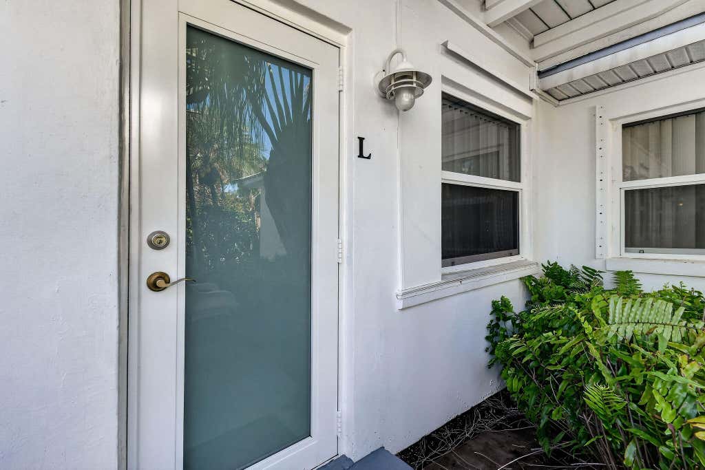 Photo of 101 Blossom Lane #L, Palm Beach Shores, FL 33404 (MLS # B26034030)