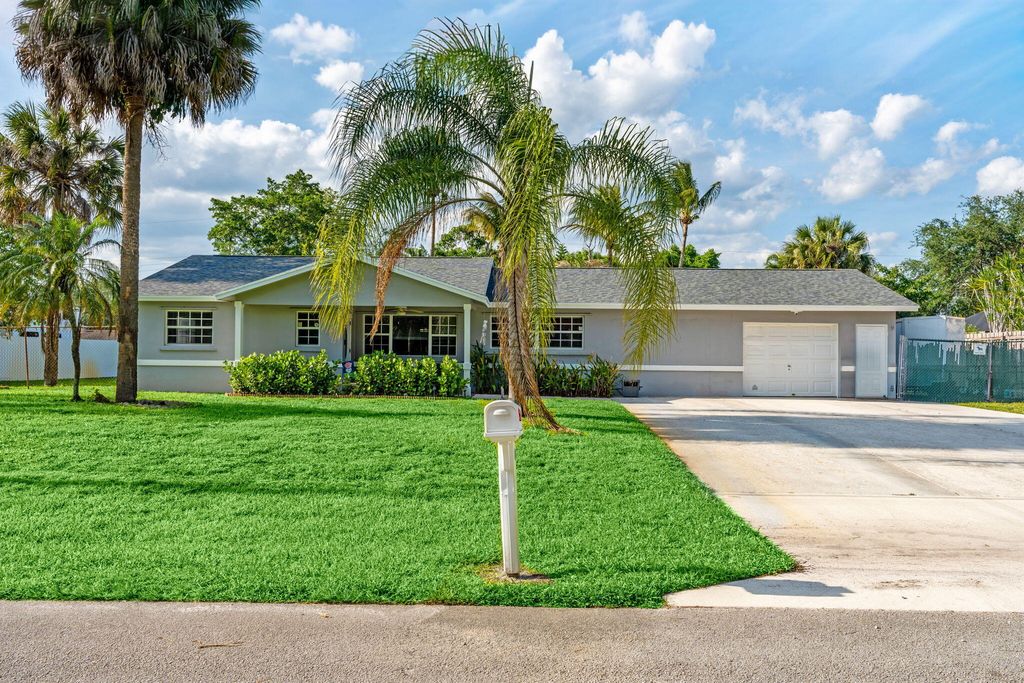 Photo of 6537 Monmouth Road, West Palm Beach, FL 33413 (MLS # B26024155)