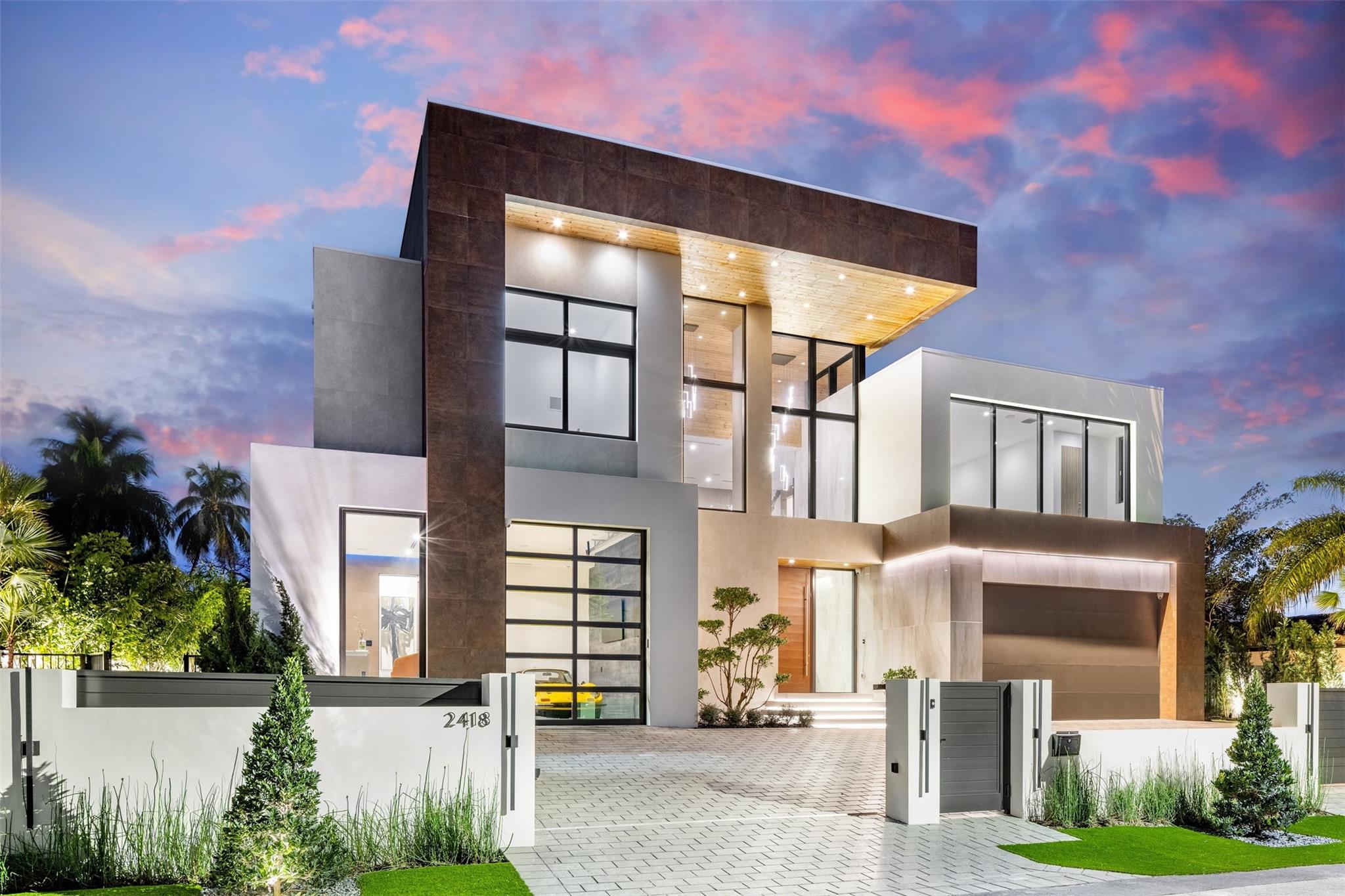 Ultra luxurious waterfront estate sited along a quiet cul de sac in Coral Ridge. Newly constructed and sophistically crafted using the finest materials and finishes. Attention to detail is seen throughout with seamless transitions, hidden doors, creative infinity pool design, and endless water views from most every room. Equipped with an elevated 54 foot powered concrete dock, covered outdoor kitchen, and lavish overflowing spa and sun lounge area.
Other features include:
Italian porcelain wall cladding, custom mill work paneling, 10 foot glass sliders, Wolf/Subzero appliances, Lutron lighting, Sonos sound system, upstairs loft bar, bedroom breakfast bar, walk in Italian closets, office/gym, and custom vanities.