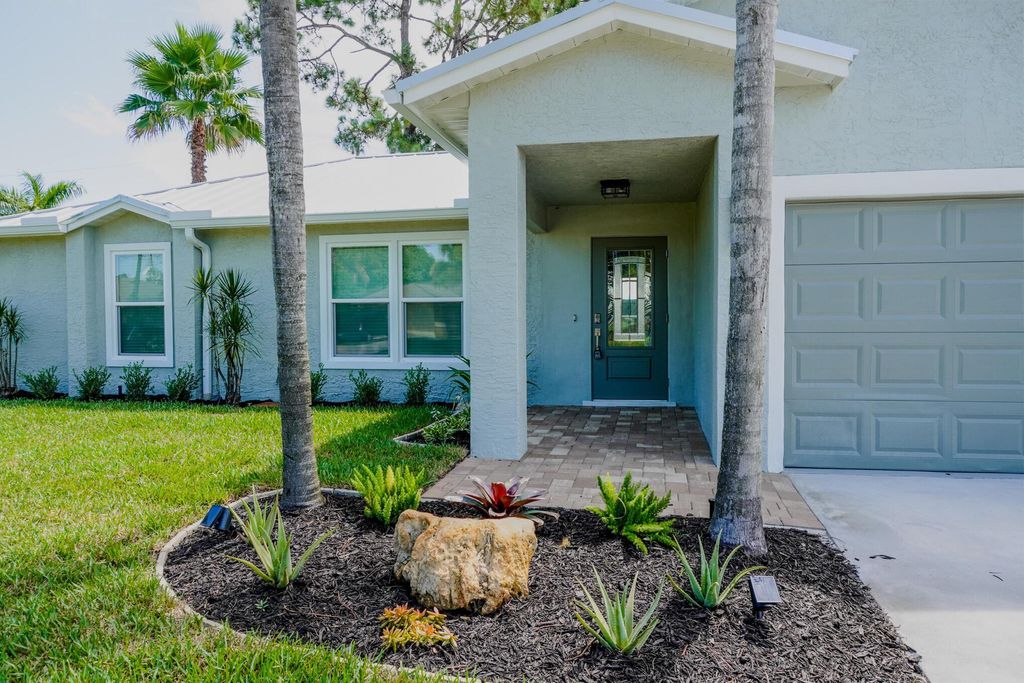 Photo of 3983 SW Helmlinger Street, Port Saint Lucie, FL 34953 (MLS # R11106396)