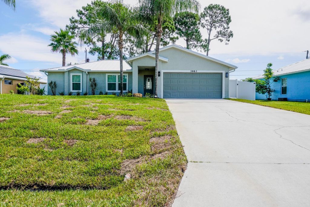 Photo of 3983 SW Helmlinger Street, Port Saint Lucie, FL 34953 (MLS # R11106396)