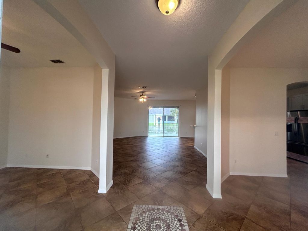 Photo of 4610 SW Pearl Street, Port Saint Lucie, FL 34953 (MLS # R10975653)
