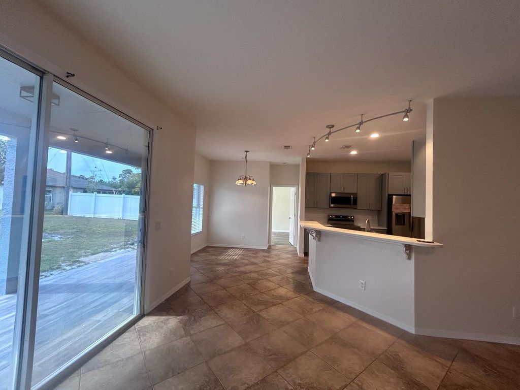 Photo of 4610 SW Pearl Street, Port Saint Lucie, FL 34953 (MLS # R10975653)