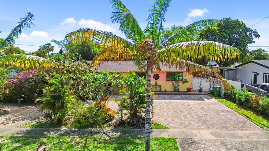 This charming home offers a spacious open floor plan designed for comfortable living and entertaining. Recent upgrades include a new tankless water heater, impact windows, and a roof installed in 2018, providing both efficiency and peace of mind. Situated on a generous lot, the property features an above-ground saltwater pool—perfect for relaxing and enjoying the outdoors.  Conveniently located near shopping centers and just a short drive to I-95, this home combines comfort with accessibility. The paved circular driveway provides ample parking, adding to the home's practicality and curb appeal.  A truly cozy and inviting property ready to welcome you home.    Escape to your own private tropical oasis—right in the heart of town. This one-of-a-kind 4-bedroom, 2-bath artist retreat offers a rare blend of serenity, creativity, and convenience. Lush fruit trees, swaying bamboo, and a tranquil koi pond create a peaceful, island-inspired setting from the moment you arrive.  Inside, the open-concept layout showcases unique architectural details, including carved ceilings and sculpted walls that add character and charm throughout. The thoughtfully designed chef's kitchen features modern appliances and a functional layout ideal for everyday living and entertaining.  Enjoy seamless indoor-outdoor living with an expansive covered lanai that opens to vibrant garden spaces—perfect for hosting, relaxing, or enjoying your morning coffee. The versatile fourth bedroom offers excellent potential for a private studio, in-law suite, home office, or guest quarters, with space for a future bathroom addition.  Set on a spacious lot with a large yard, quiet surroundings, and ample parking, this property offers both privacy and convenience just minutes from local amenities. A truly unique home that combines lifestyle, comfort, and artistic flair.