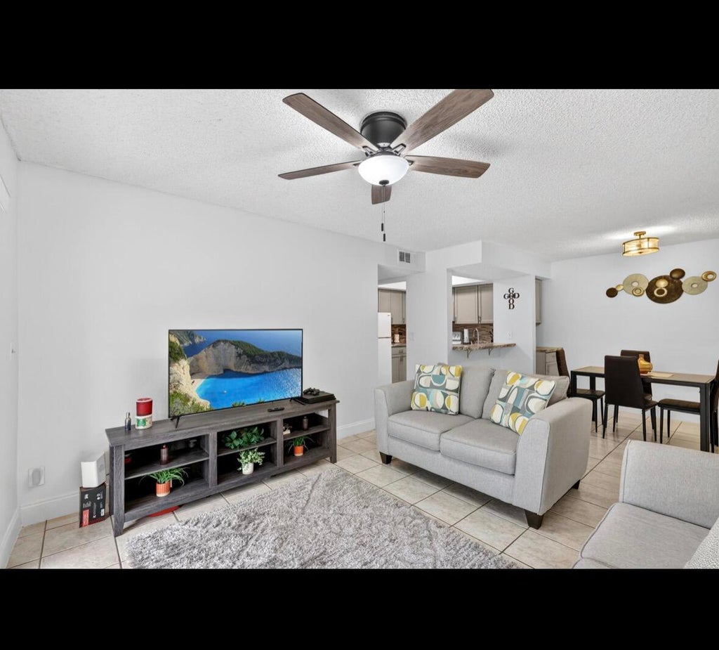 Photo of 1548 SE ROYAL GREEN Circle #206, Port Saint Lucie, FL 34952 (MLS # B26074932)