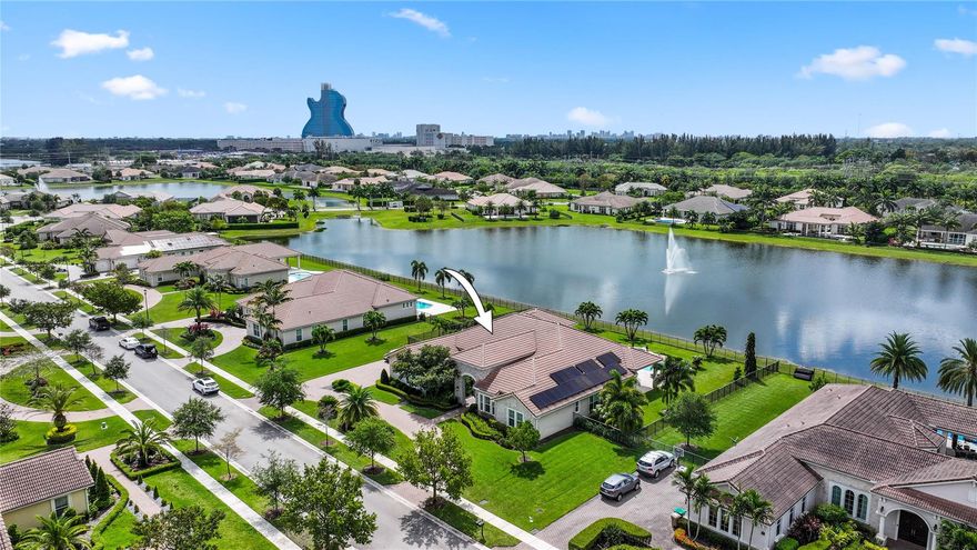 Masterfully reimagined & crafted for luxurious living, this 4-bed | 4-bath estate in the prestigious gated enclave of Sterling Ranch embodies modern elegance at every turn. Nestled on a sprawling homesite, this custom residence showcases soaring ceilings, expansive open-concept living, and curated finishes. The gourmet kitchen boasts a grand quartz island, premium self-cooking Sub-Zero & Monogram appliances, double ovens, and an oversized walk-in pantry. Retreat to a spa-like primary suite with dual walk-in closets, a freestanding soaking tub, & his-and-her shower. Impact windows & doors, plus a 3-car garage, complete the package. Enjoy a solar-heated Salt water pool & lush yard with mango, lemon, and cherry trees. Minutes from top-rated schools, shopping, dining, and the Hard Rock Hotel.