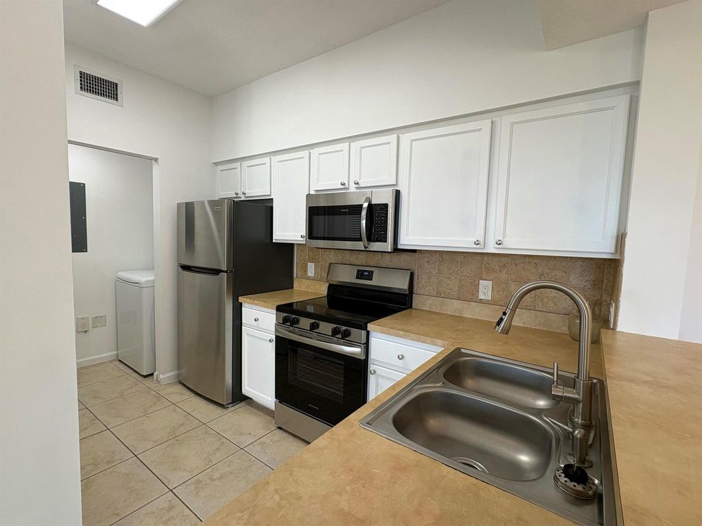Photo of 1306 E Myrtlewood Circle E #1306, Palm Beach Gardens, FL 33418 (MLS # R11072872)