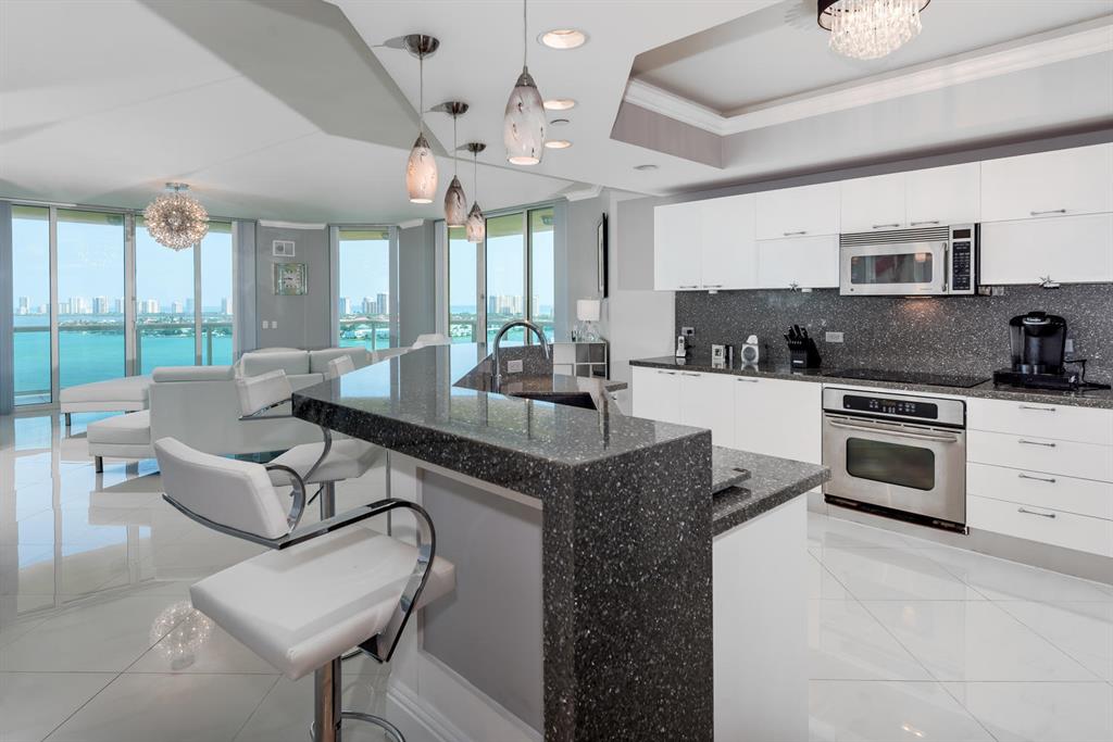 SPECTACULAR CORNER UNIT WITH OCEAN VIEWS. Trophy Property at Marina Grande! 180 Degree panoramic views along the blue water of the Intracoastal Waterway and Atlantic Ocean. Three bedrooms en suite, Open Floor Plan Living Area. Contemporary Style with custom details throughout include white porcelain tile flooring, Quartz Counter Tops, SS Appliances, Crown Molding, Crystal Chandeliers. All impact glass and glass walled balcony, 9.5 ft. ceilings, showcase the natural light. Conveniently located close to world class beaches, golf, tennis, shopping and restaurants. Close to the I-95, PGA Blvd Corridor, and Palm Beach Island. Drive to Wellington to watch Polo in 15 minutes. Available for Season 2020 or Annual Lease. Discover the Best Kept Secret in Palm Beach!!
