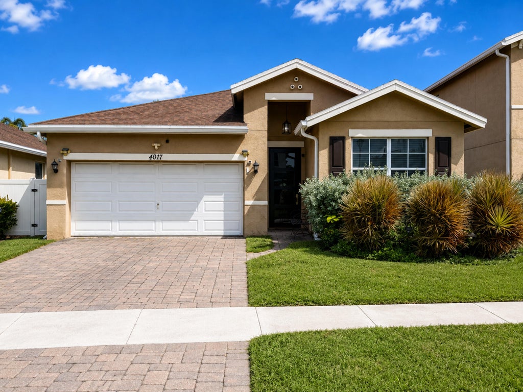 Photo of 4017 Tomoka Drive, Lake Worth, FL 33462 (MLS # B26072494)