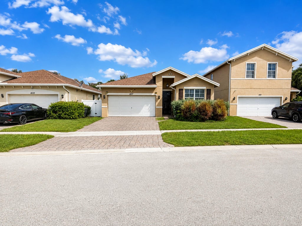 Photo of 4017 Tomoka Drive, Lake Worth, FL 33462 (MLS # B26072494)