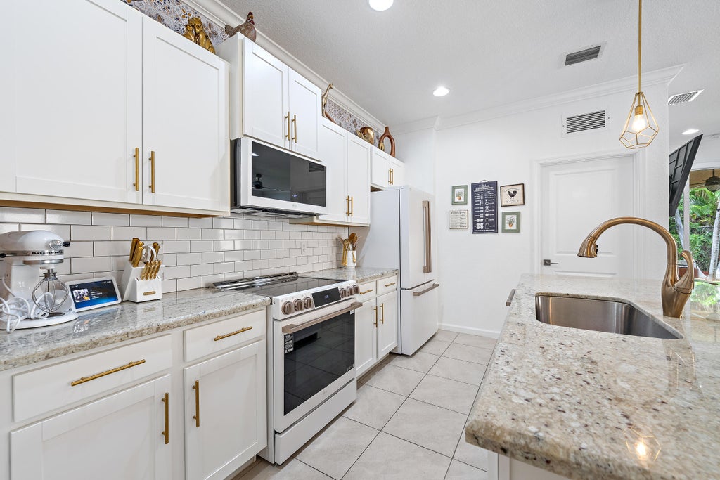 Photo of 4017 Tomoka Drive, Lake Worth, FL 33462 (MLS # B26072494)