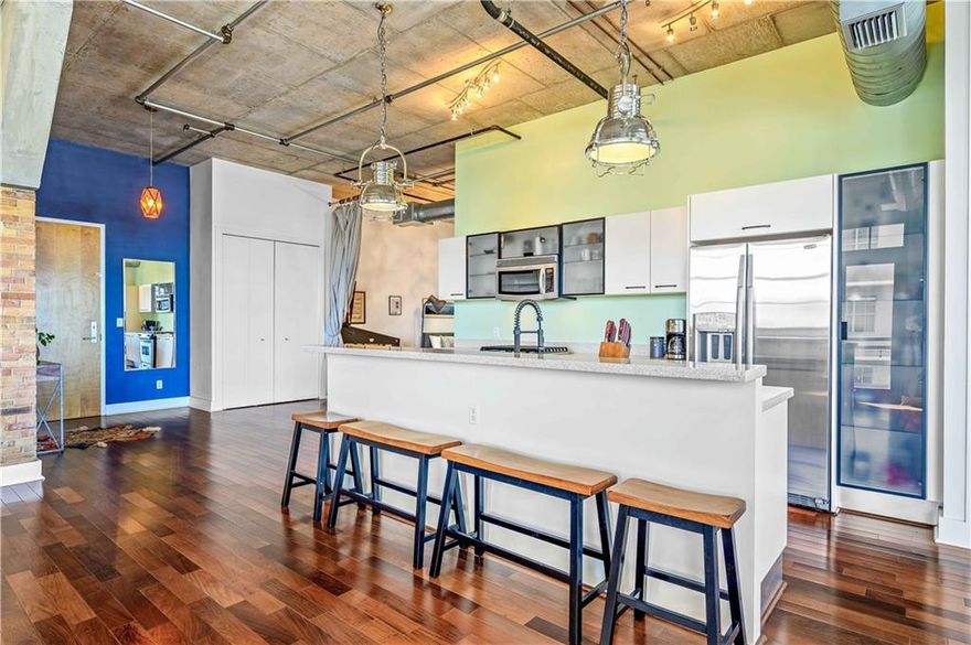 Loft Living in the Heart of EVERYTHING!  Spacious open and light corner unit 2 bedroom 2 bath industrial styled loft in the uber cool Foundry Lofts.  Exposed ducts, concrete block walls, 12 ft ceilings, exposed ducts, expansive windows and a covered terrace. Floors need replacement .GAS COOKING!  Generous closet space and a custom walk in master closet.  One covered garage space, gym and soon to be renovated pool. One block to the Brightline high-speed train station to Miami and West Palm, one block to the FAT Village artwalk. Be in the heart of all the amazing changes coming to Flagler Village.