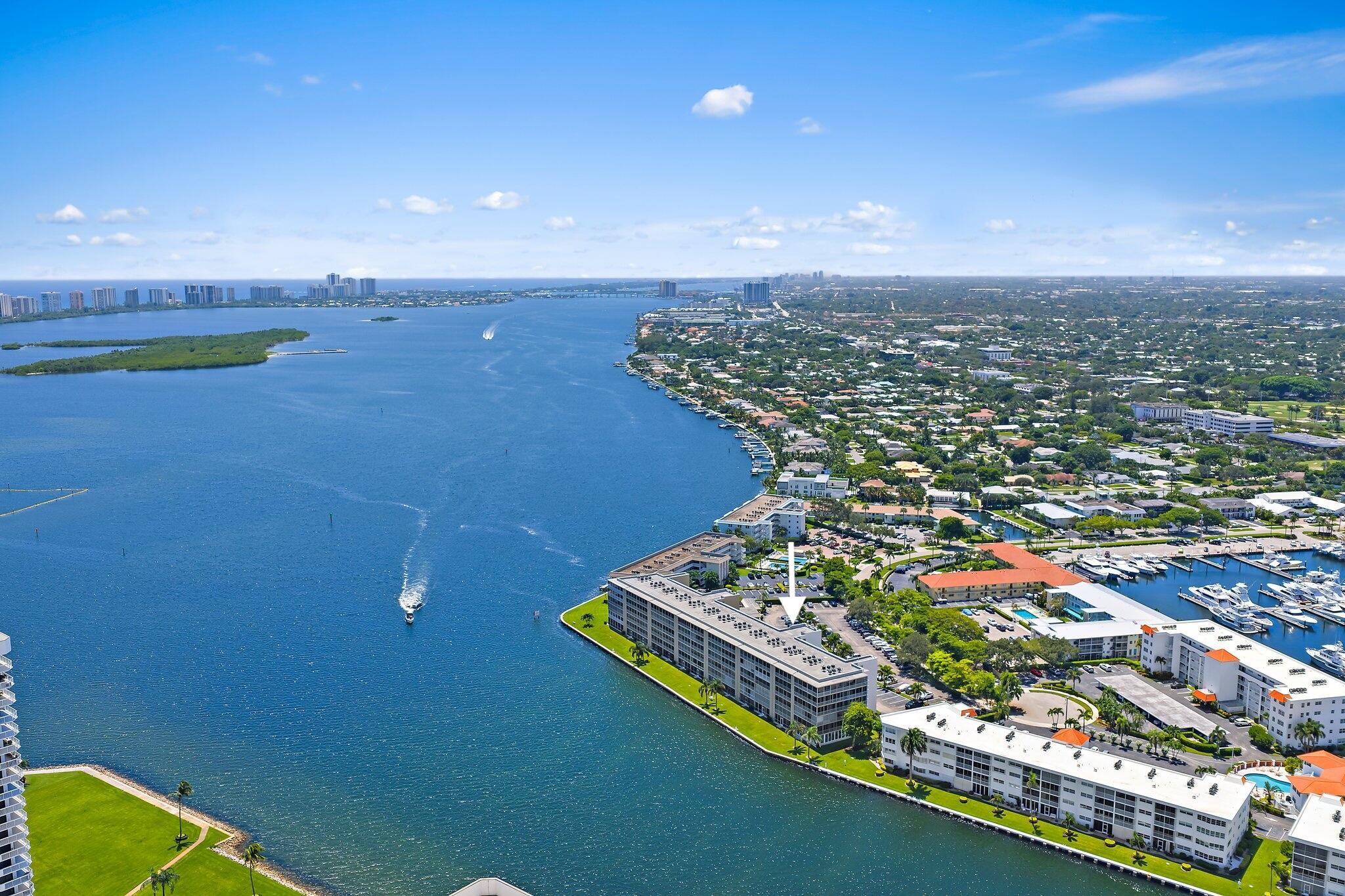 Enjoy spectacular, close-up views of the Intracoastal from your large screened and enclosed balcony at Lands End Condo in beautiful North Palm Beach. Watch the boats cruise by or take in the sunrise each morning--these stunning views can also be enjoyed from the living room, dining room and primary bedroom. As the sellers say, ''We bought the view, and the beautiful condo came with it.'' This warm and spacious residence offers over 1,300 sq. ft. with two large bedrooms, huge walk-in closets, and two updated full bathrooms. The remodeled kitchen features real wood cabinetry, soft-close drawers, roll-out shelving, cutlery drawers, and newer appliances, including a 2025 dishwasher and refrigerator. Crown molding in the living/dining and primary bedroom, impact glass and sliders, plantation