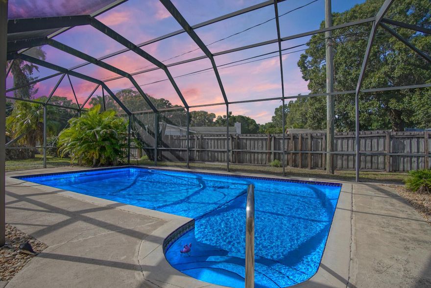 Discover this well maintained 4 bedroom, 3 bathroom CBS, 0.5 acre estate featuring a 2023 metal roof, full accordion shutters, and a private fenced yard with a  pool, expansive patio, and a 10x20 shed that conveys. Inside, the home offers a comfortable layout with plenty of space for living and entertaining. The oversized 2.5 car garage includes its own full size bathroom, creating a great opportunity to convert it into an ADU or keep it an ideal workshop. This property delivers security, versatility, and true Florida living.