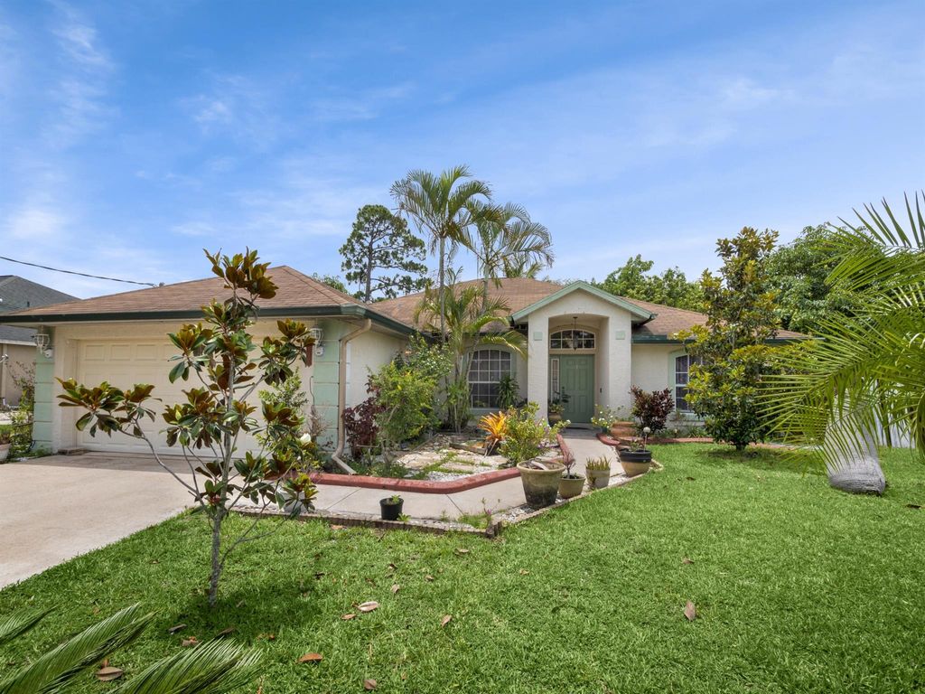 Photo of 1582 SW Latshaw Avenue, Port St Lucie, FL 34953 (MLS # R10896575)