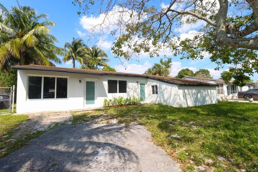 Discover this beautifully remodeled 5 Bedrooms 3 Bathroom property with a flexible 2bed 1bath suite, ideal for guests or rental income, complete with separate entry and kitchenette.  Kitchen area has custom cabinetry, farmer's sink, quartz countertops, center island with premium stainless steel appliances. This cozy home has bright recess lighting and vinyl floors. All bathrooms have porcelain tile, modern fixtures and a luxurious dual sink in the master. Recent upgrades include brand new electric and plumbing systems, main AC unit, two mini splits and a new roof. This home also includes impact windows. Step outside to a massive backyard giving you space to build your future pool. This home is located in desirable neighborhood with no HOA.