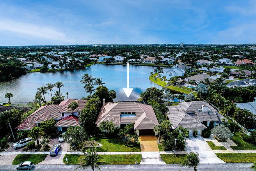 Just a short distance to the beach from this beautiful 1 story 3 bedroom, 3.5 bath, 2 car garage pool home in Olympus. Wonderful open floor plan with loft.  Enjoy the screened pool on an oversized patio with summer kitchen on Lake Olympus with expansive views in a very private setting.  Lovely landscaping. Kitchen has granite counters, prep island / breakfast bar and an amazing amount of custom wood cabinets. All bedrooms have on-suite bathrooms.  Main bedroom has beautiful coral fireplace.  Roof 2022. 3 air conditioners (2021, 2017,2013).  Two hot water heaters (2018) Garage door 2018.  Community offers tennis courts and private path to the beach. Restaurants and shopping nearby. Come find your home in paradise. Room sizes subject to buyer verification