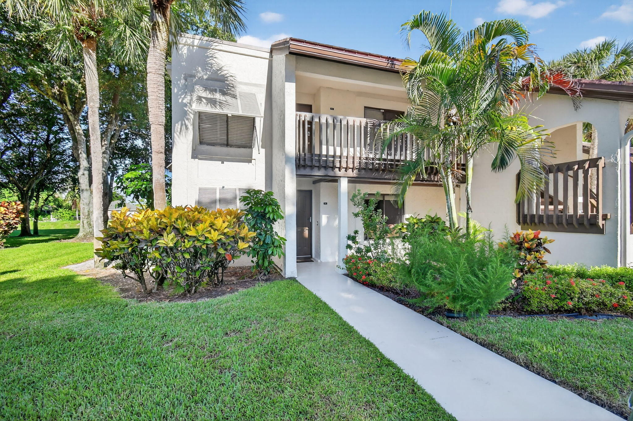 Welcome to Banyan Springs, a premier active adult community. This spacious, first-floor corner condo is a rare find, offering two bedrooms and two bathrooms in a light-filled, open-concept layout. Residents enjoy an incredible array of amenities, including a resort-style pool, tennis courts, pickleball, bocce ball, an on-site cafe, a library, and much more. Perfectly located, you are just a short drive from the beach, fantastic restaurants, and shopping. This is your chance to embrace a vibrant, low-maintenance lifestyle in a highly sought-after community.