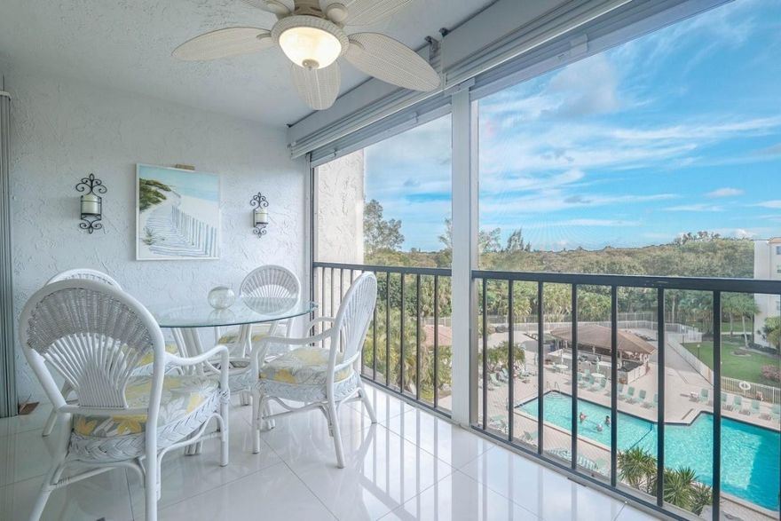 Completely Remodeled! Fabulous views on the pool area & gazebo from the terrace with Roll Shades! Sold fully furnished some exceptions. Light & Bright! Impact windows, & large beige ceramic tiles! Washer & dryer in unit. Spacious master bedroom with 2 walk-in closets. . Kitchen nicely remodeled with granite counters and large opening onto the dining rm,  bathrooms redone!. AC 2021 New electric panel! New tankless waterheater! Cable TV & HBO & internet included in maintenance! 24/7 guarded gate and fenced in! 55+ community. No Pets. Features tennis courts, heated pool, clubhouse, BBQ area, pickle ball courts, & much more. Per Association 710+ credit required, 55+, $45k minimum income, 6 months maintenance in escrow & requires 20% down with offer. if financing 25%. Come see for yourself!