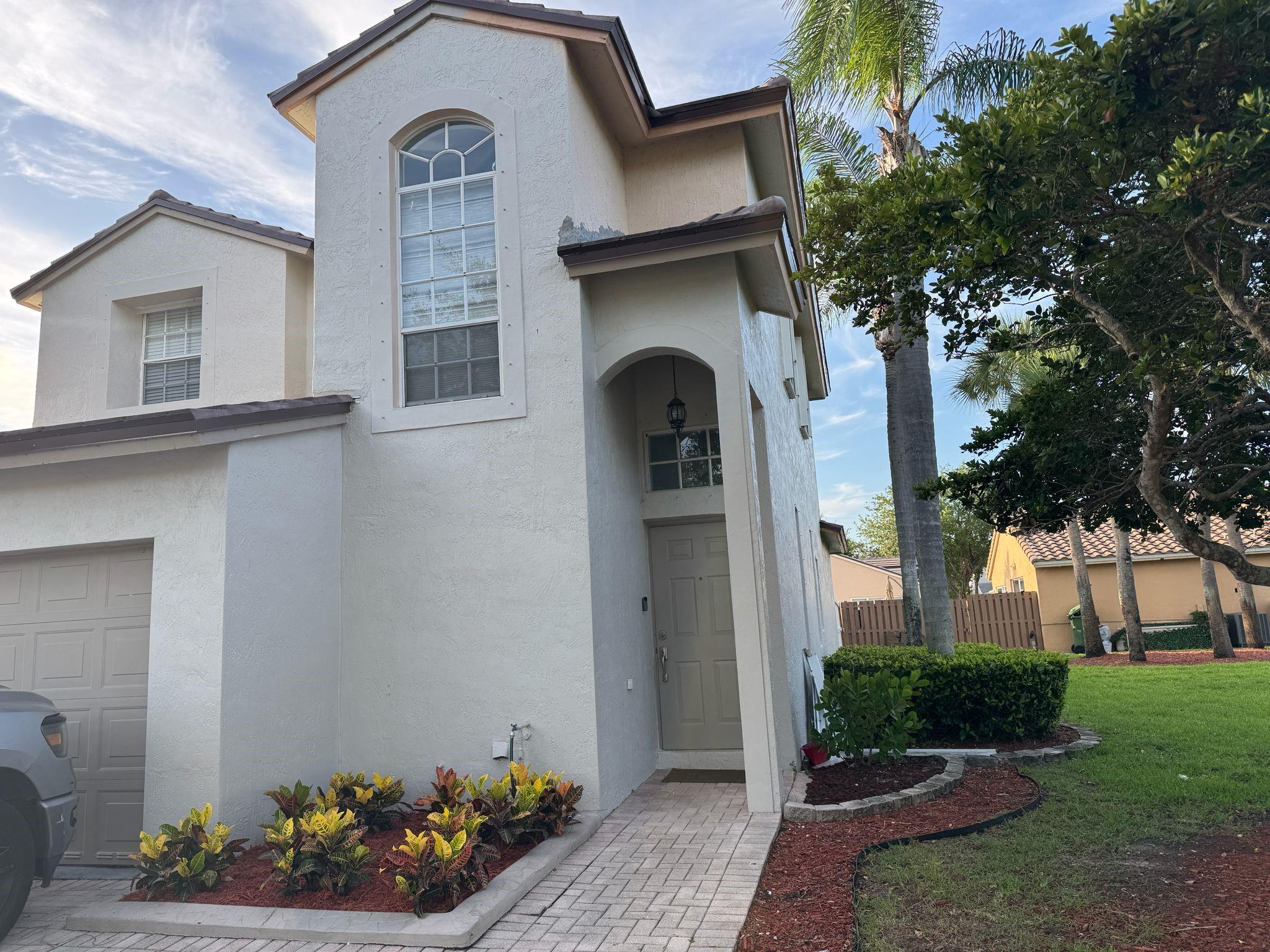 Upgraded & fully remodeled home features 4 bedrooms & 2.5 bathrooms and a huge loft perfect for work, study, or play. In resort-style community of Pembroke Isles. Home boasts an impressive yard complete with a pergola, ideal for entertaining. The convenient downstairs master suite, w/ full modern bathroom, is perfect for guests or multigenerational living. The kitchen showcases upgraded shaker cabinets & modern finishes, while the bathrooms reflect contemporary design. Brand new roof installed 2025, a new AC from 2024. Fresh paint inside and out. Gated community w/ 24-hour manned security; tons of amenities, including 3 pools, tennis courts, a gym, pickleball courts, playgrounds, and a stunning clubhouse, along with cable and Wi-Fi services. This home is also zoned for A-rated schools.
