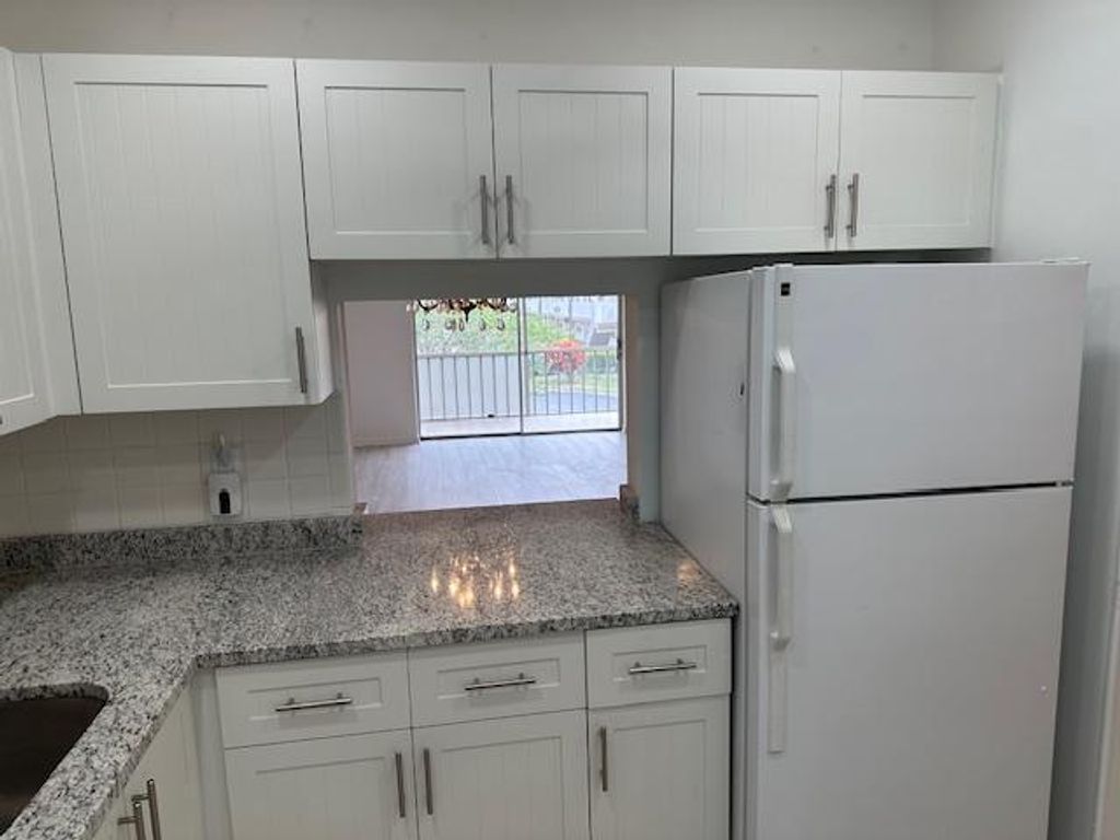 Photo of 7805 W Atlantic Boulevard #202, Margate, FL 33063 (MLS # B26019975)