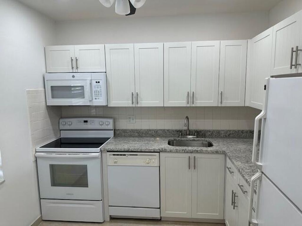 Photo of 7805 W Atlantic Boulevard #202, Margate, FL 33063 (MLS # B26019975)