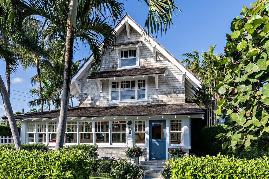 This Seabreeze Avenue property perfectly blends timeless historic charm with modern functionality. Built in 1920, this spacious home has 5 bedrooms, 4 and a half bathrooms, and is ideally situated on a prime lot in one of the most sought-after in town neighborhoods on the island of Palm Beach.
The main house is designed with elegance and comfort in mind, featuring 3 bedrooms and 2 and a half bathrooms. The inviting layout includes a living room, a formal dining room, an enclosed wrap-around sunroom, and kitchen with top-of-the-line appliances.  With 3,598 total square feet, the home preserves its classic character while offering the conveniences of modern living. A dedicated laundry room adds practicality and convenience to the home.
A detached 2-car garage with a guest house above offers the perfect private retreat. The guest house includes 2 bedrooms, 2 bathrooms, a full kitchen, living room, dining area, and laundry ideal for hosting guests or providing independent living space for extended family.
The property is beautifully enhanced with tropical landscaping by Fernando Wong, creating a serene and private atmosphere. The main and guest houses are joined by a large covered seating area and private courtyard with fountain, that seamlessly flows from one house to the other, for the ideal outdoor entertaining space. Its unbeatable in-town location places you just moments away from the beach, restaurants, shopping, and the Lake Trail.