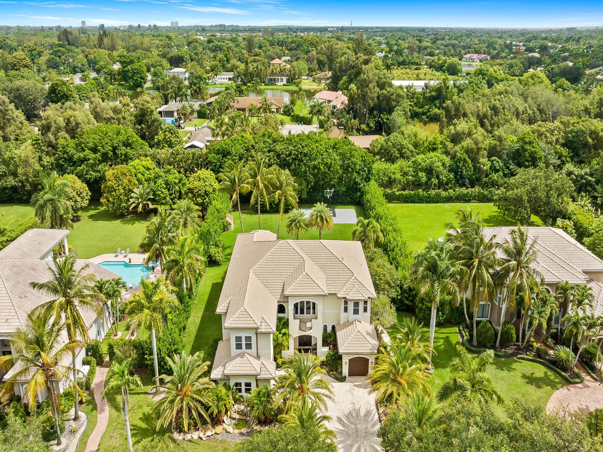 Welcome to a true modern masterpiece nestled in the sought-after guard gated community of Long Lake Ranches in Davie. This stunning estate features 6 spacious bedrooms, 6 luxurious baths, and over 5,700 square feet of impeccably designed living space.
Set on a sprawling 35,000 square foot lot surrounded by lush landscaping, this home offers ultimate privacy and serenity. Every detail has been thoughtfully curated by an interior designer, combining contemporary style with timeless sophistication. Expansive hurricane impact windows flood the home with natural light while providing peace of mind.
Located in a guard gated community next to scenic Tree Tops Park and minutes from top-rated Broward schools, this home delivers the perfect mix of luxury, privacy, and location.