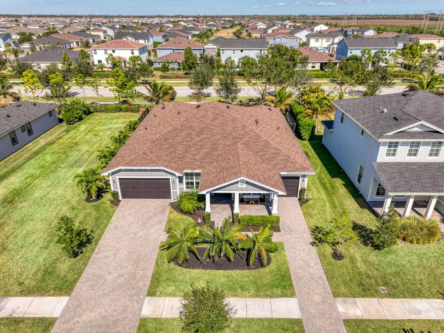 This spacious 4BR, 3.5BA residence offers over 3,000 square feet of luxurious living space, all thoughtfully upgraded, and featuring a den which provides flexible space for a home office, playroom, or future fifth bedroom. The open layout is perfect for entertaining, with a gourmet kitchen boasting a built-in gas range, solid wood cabinetry, and custom wood accent walls. The great room features a built-in mini bar with a high-end wine cooler, tray ceilings, and seamless access to the screened-in patio and extended backyard. The fenced-in yard includes gas hookups and is ideal for outdoor gatherings, pets, and play. Landlord covers landscaping, pest control, and routine A/C maintenance. Upgrades include a Tesla fast charger, epoxy garage floors, security cameras, and stylish ceramic tile throughout. Located in the resort-style, gated community of Arden, residents enjoy miles of scenic trails, community pools, fitness center, lakes, green spaces, and a vibrant lifestyle perfect for outdoor enthusiasts.